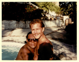 Photograph of Sylvester kissing a companion, believed to be his partner Rick Cramer.