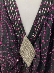 A cape and headpiece worn by Sylvester while performing. This garment appears to be handmade. There is no designer label attached to this garment. This item is undated.