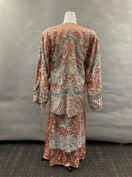 Peach sequined tunic and skirt with crane motif rear
