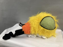 Yellow insect headpiece used as part of a costume in an unidentified Thrillpeddlers production. This item is undated. 