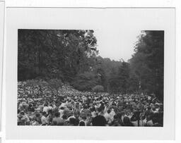 A crowd of people at an outdoor event, from the same roll of film as the Vanguard Street Sweep photographs.