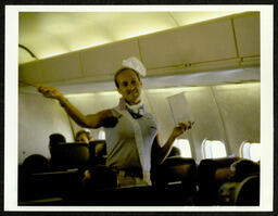 Chorus member on plane during their 1981 National Tour. Pictured in this photograph: John Riccardi.