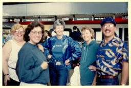 Photograph of Chorus members at the airport on their way to the GALA Choruses Festival in Denver, Colorado. 