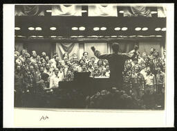 Photograph of the San Francisco Gay Men's Chorus performing with conductor, Dick Kramer. 
