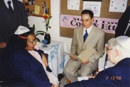 Cora Latz, Etta Perkins, and their officiant at their 1998 vow renewal at the Jewish Home for the Aged.