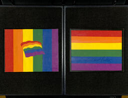 Two pieces of paper cutout art created by Gilbert Baker and depicting rainbow flags.