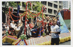 Bay Area American Indian Two Spirits (BAAITS)'s float and parade contingent during the 2008 San Francisco Pride Parade. The float featured a teepee painted to look like the earth, a seating area for community elders, and dancers. 